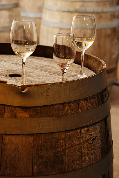 istock wine glasses on an old wooden barrel 93444746