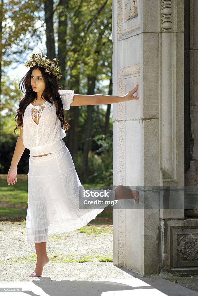 Young woman outside leaning on a wall  Adult Stock Photo