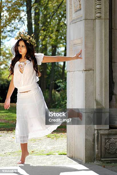 Young Woman Outside Leaning On A Wall Stock Photo - Download Image Now - Adult, Adults Only, Angel