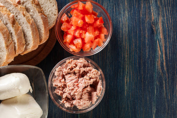 istock Ingredients ready for preparing bruschetta with tuna, mozzarella 934472848