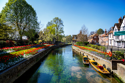 Canterbury, England - A shot looking up one of the many beautiful canals of Canterbury.  This city can be found in the South East of England and is extremely popular with tourists from all over the world.  Tourists can take punting tours on the canal.