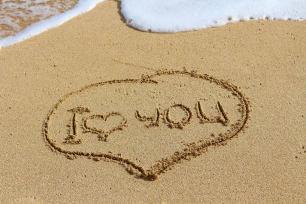 istock The writing on sand, I love you. Oceanic foam. 934478222