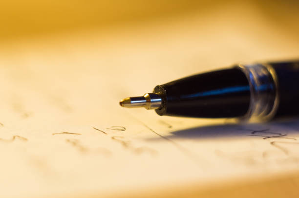 istock ball point pen and a sheet of paper 934483290