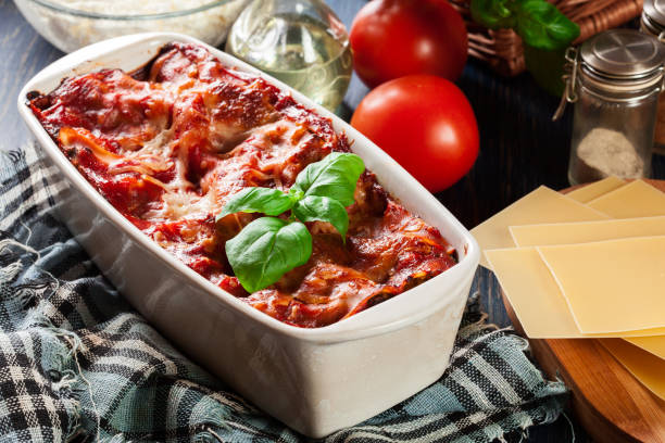 istock Hot tasty lasagna with spinach in ceramic casserole dish 934485928
