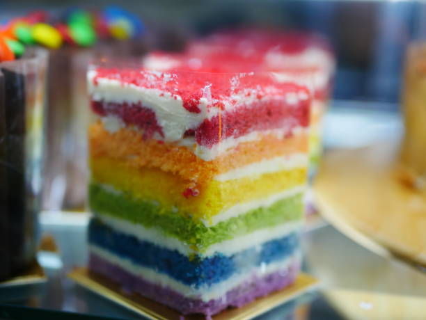 istock Delicious rainbow cake on wood plate 934486262