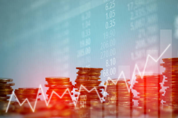 istock Double exposure of coin stack with stock market screen chart board and candle stick for financial business and investor analysis concept. 934491534