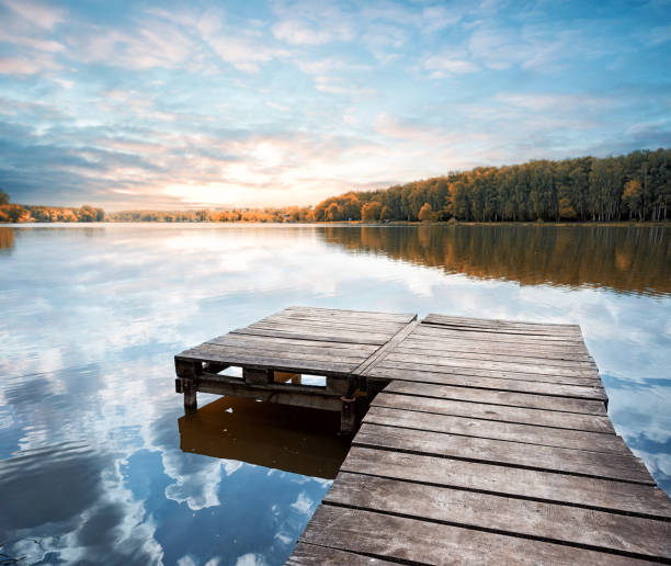istock Wooden pier stretching into the lake 934492810