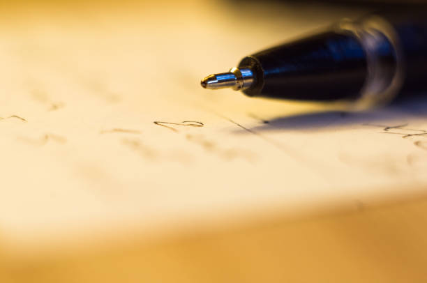 istock ball point pen and a sheet of paper 934495528