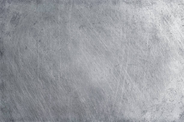 istock aluminium texture background, scratches on stainless steel. 934499118