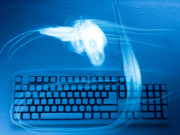 istock computer keyboard covered with snow illuminated by blue light with traces from drawing by light 934499410