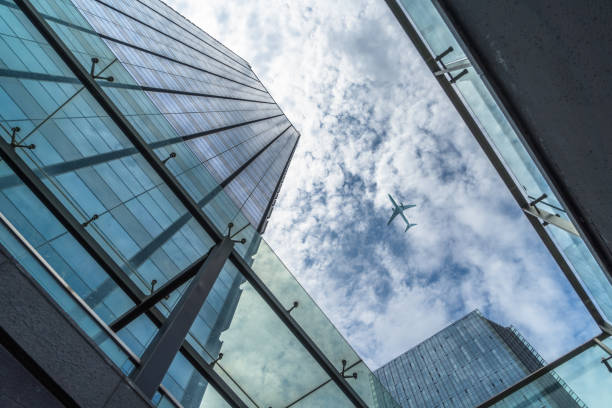 istock Plane flying over the skyscrapers 934502902