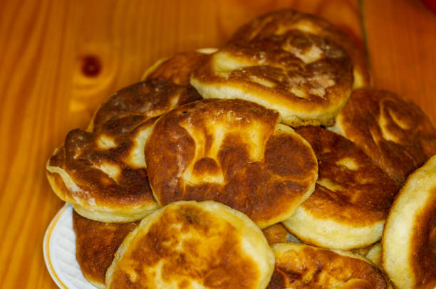istock Russian pirozhki, fresh fried pasties stuffed with potatoes 934503708