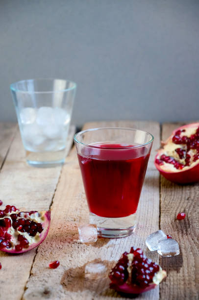 istock Pomegranate Juice with Ice and Fruit on Wooden Table. Refreshing Summer Drink 934506150