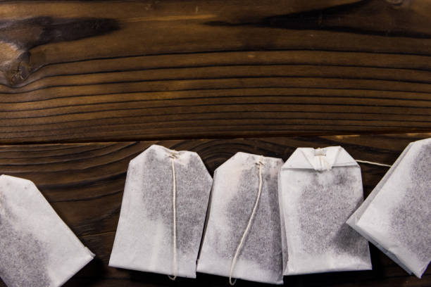 istock Tea bags on wooden table. Top view 934506334