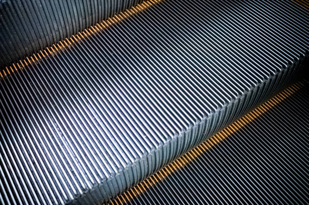 istock Close up to modern escalator ,Metal escalator step texture 934509136