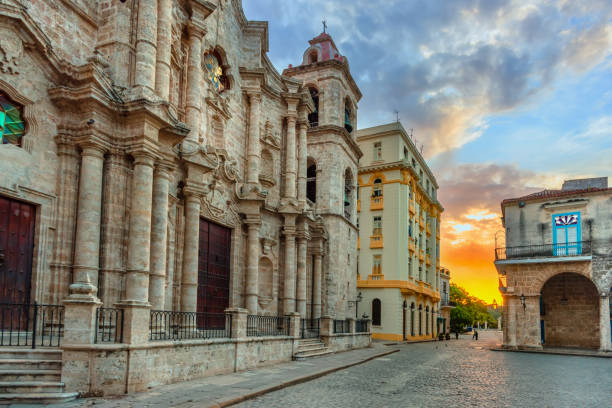 istock Orange sunset in an ancient square with a stone temple and cobblestone pavement 934513916