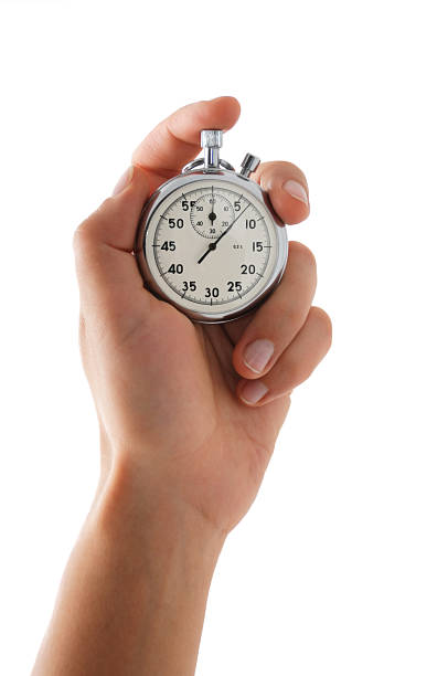 Running stopwatch in the hand Running stopwatch in the hand, vertical composition, isolated on white stopwatch photos stock pictures, royalty-free photos & images
