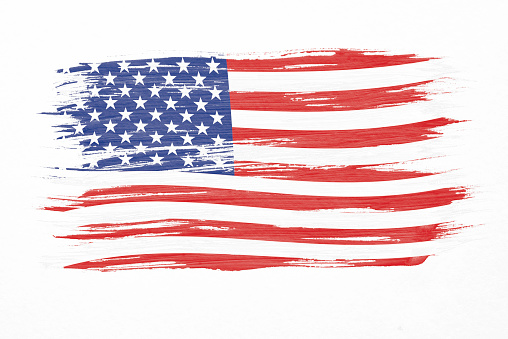 Flag of the US, the Stars and Stripes, on richly textured paper.