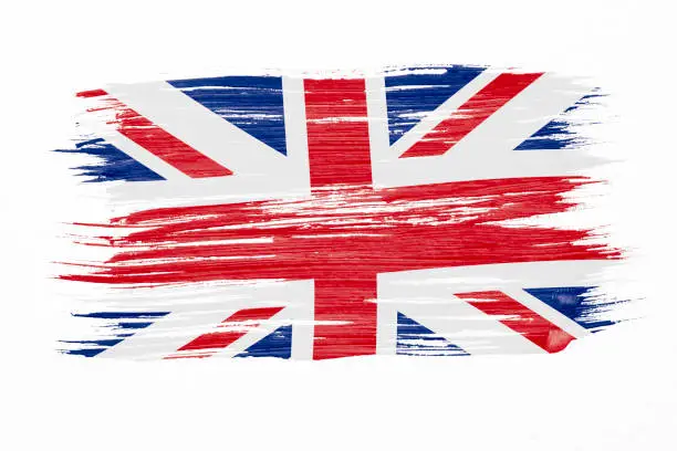 Photo of Art brush watercolor painting of UK flag blown in the wind isolated on white background.