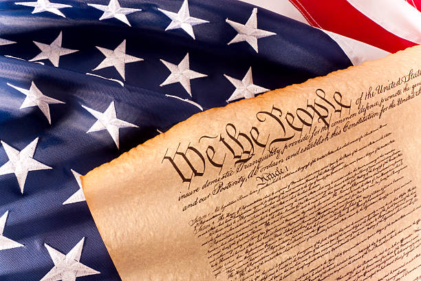 Close-up of legal documents arranged on American flag