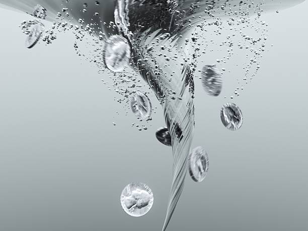 High detail CGI representation of quarter dollars being sucked down a plughole with slight motion blur for intensity. For an animated version of this, please see my portfolio.