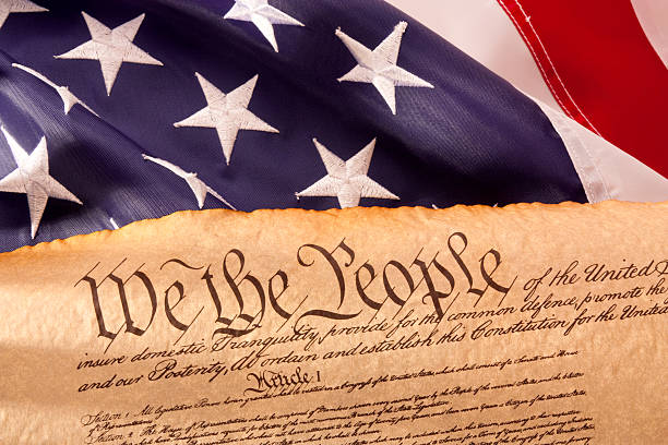 US Constitution - We The People   with USA  Flag. stock photo