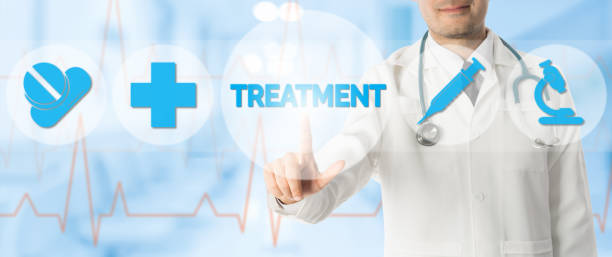 istock Doctor Points at TREATMENT with Medical Icons 934566726