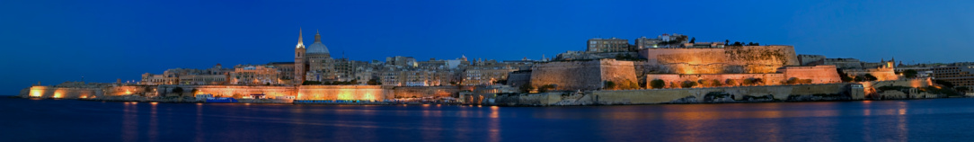 Panorama of the fortified city of Valletta by night. Beautiful skyline and bastions of this UNESCO world heritage site.