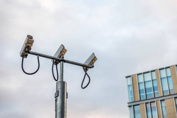 istock Outdoor CCTV Security camera facing up in British city 934576774