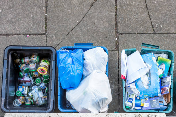 istock Overhead day view plastice waste refuse bins boxes on British road 934576802