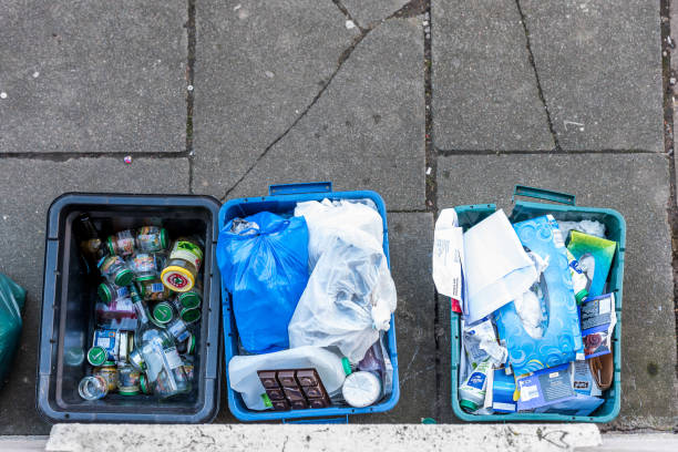 istock Overhead day view plastice waste refuse bins boxes on British road 934577008