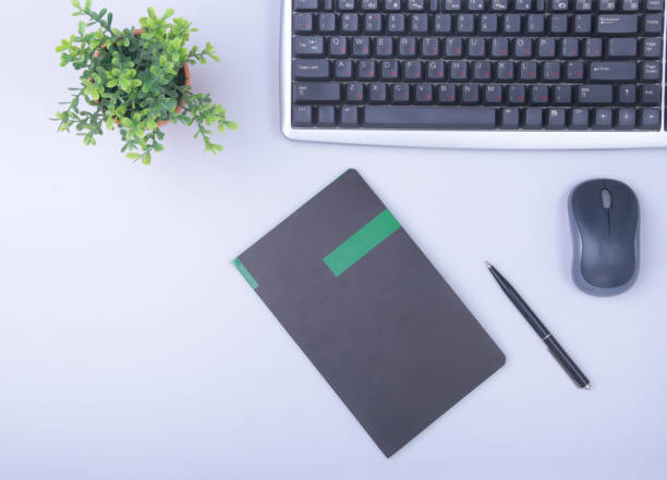 istock Modern office table with keyboard, phone, notebook on white background top view mock-up. copy space 934582596