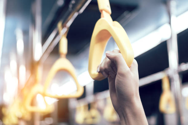 istock Young passenger man hand holding handrail in subway. 934582712