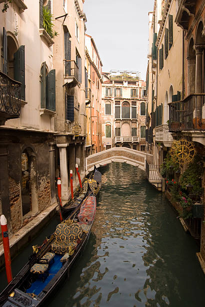 Venice canal with Gondula stock photo