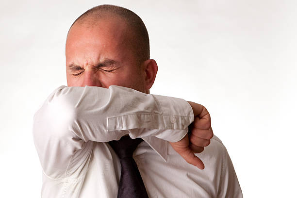 istock Man Coughing or Sneezing into Arm/Elbow 93458674