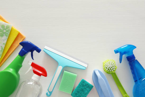 istock Spring cleaning concept with supplies on wooden table. 934587498