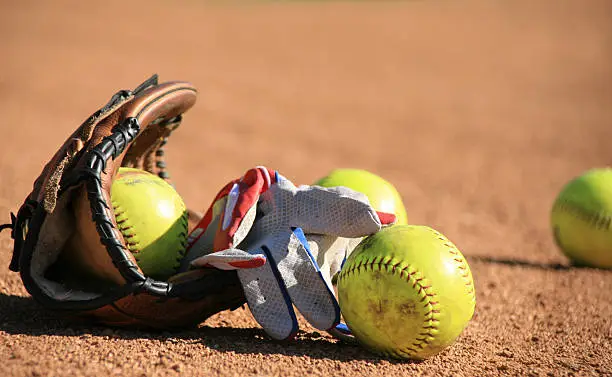 Photo of Softball Baseball balls and batters glove