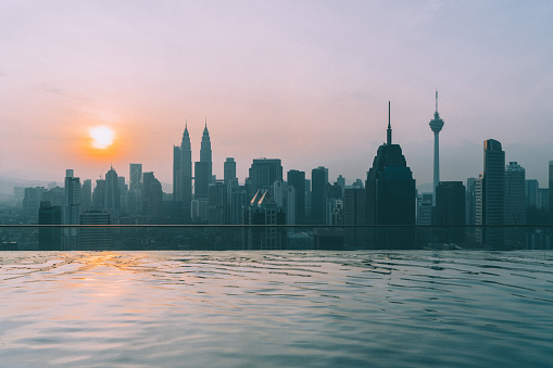 Swimming pool on roof top with view of Kuala Lumpur Petronas towers