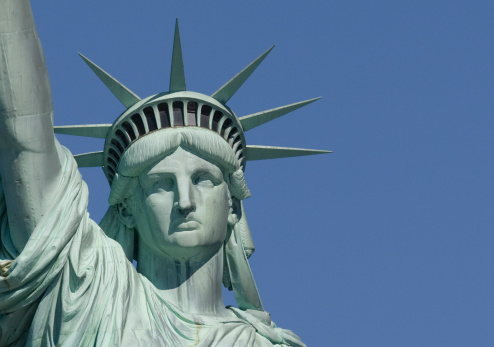 Close up photo of Statue of Liberty at dawn - New York City