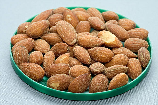 plate of almonds stock photo