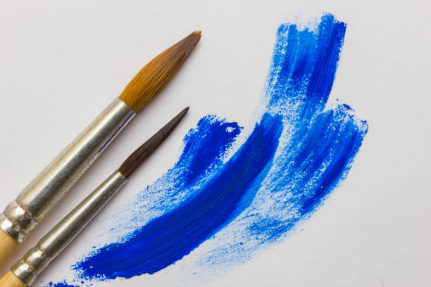 istock colored paints and brushes for painting 934607782