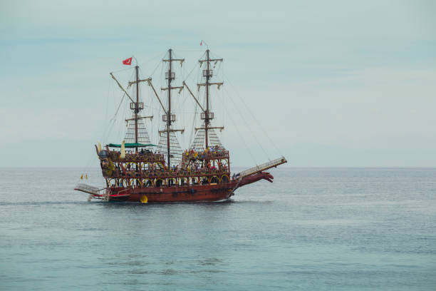 istock ancient pirate ship by the shore. Turkey 934607796