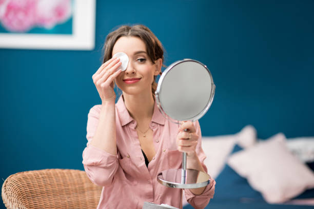 istock Woman using cotton swab indoors 934608064
