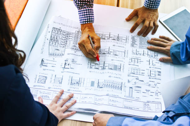 istock Architect and Engineer Team Discussing the Blueprint on the Table 934617198