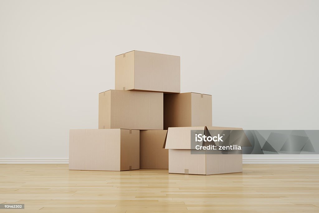 Stack of cupboard boxes on a wooden floor  3d rendering of cardboard boxes in a empty room Box - Container Stock Photo