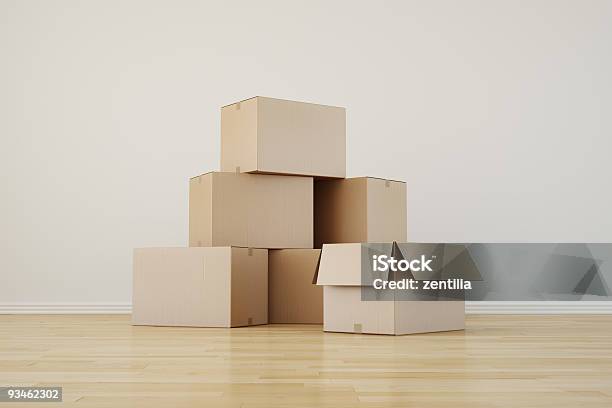 Stack Of Cupboard Boxes On A Wooden Floor Stock Photo - Download Image Now - Box - Container, Brown, Cardboard