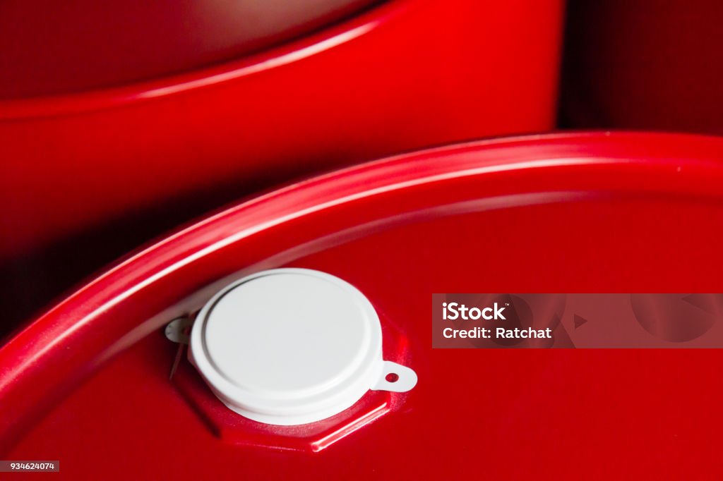 red oil steel container with white metal cap Barrel Stock Photo