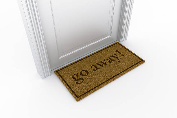 istock Door with "go away" doormat 93462433
