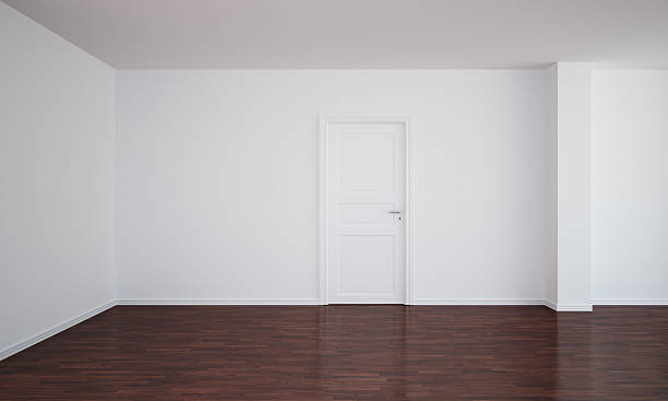 istock Empty room with a closed door and dark floor 93462435