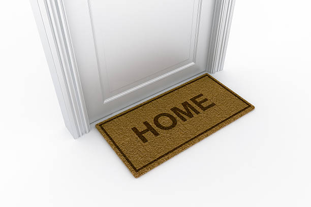 istock Door with "home" doormat 93462550